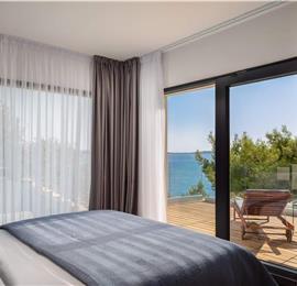 Luxury Beachfront Villa with Heated Infinity Pool near Trogir, Sleeps 8